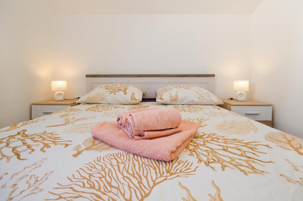 Posteľ alebo postele v izbe v ubytovaní Apartman Korina