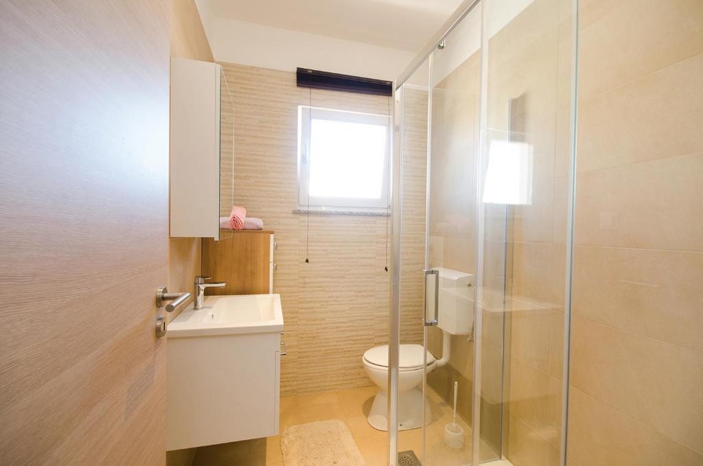 Kúpeľňa v ubytovaní Apartman Korina