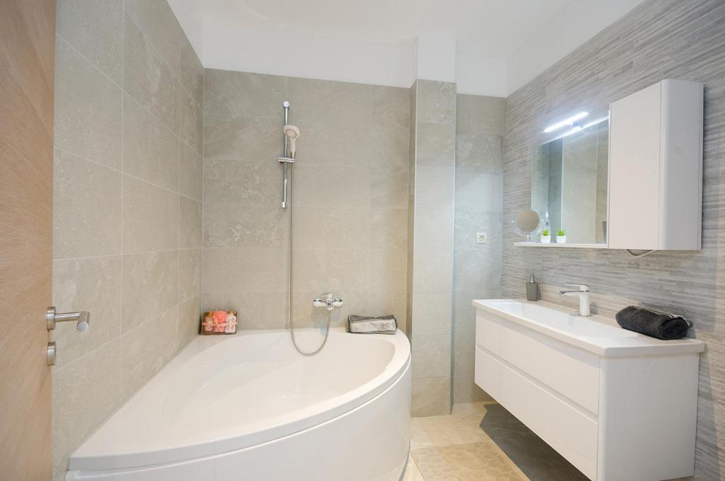 Kúpeľňa v ubytovaní Apartman Korina