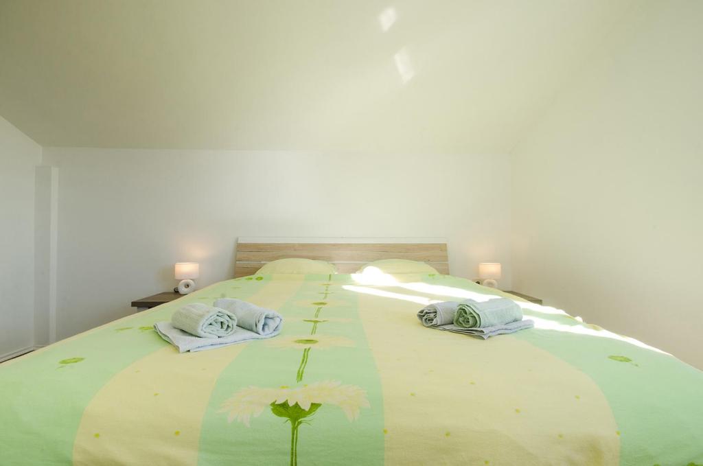 Posteľ alebo postele v izbe v ubytovaní Apartman Korina