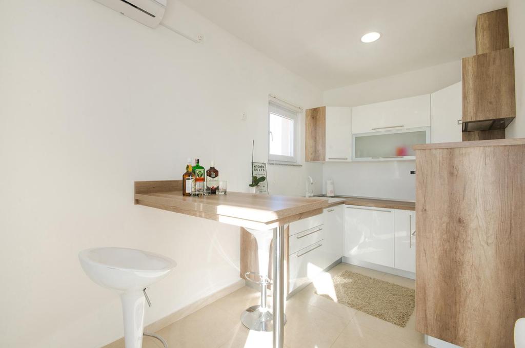 Kuchyňa alebo kuchynka v ubytovaní Apartman Korina