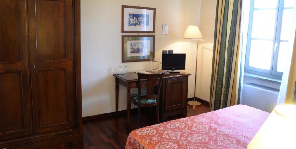 Postel nebo postele na pokoji v ubytování Villa Chiara Hotel
