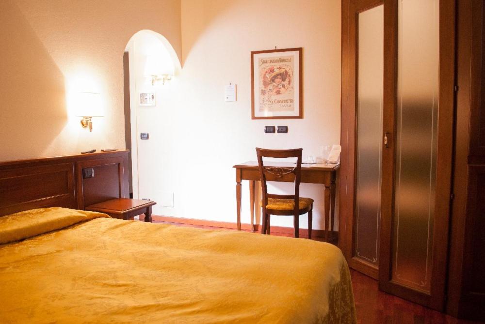 Postel nebo postele na pokoji v ubytování Villa Chiara Hotel