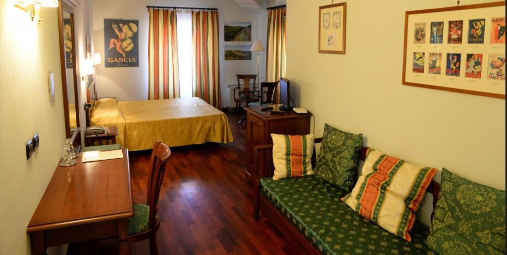 Postel nebo postele na pokoji v ubytování Villa Chiara Hotel