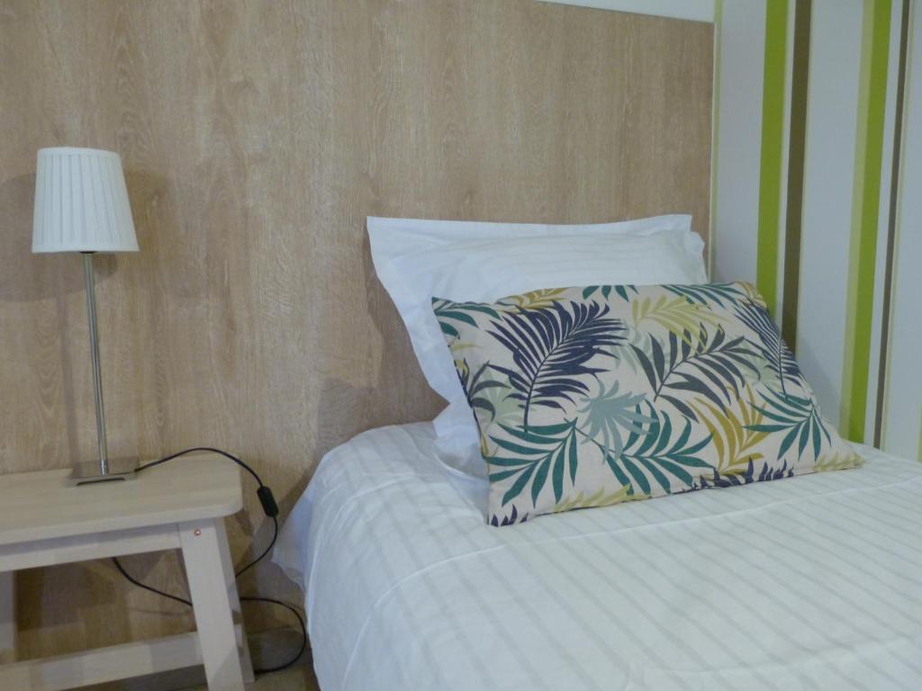 Postel nebo postele na pokoji v ubytování Villa Thebaïde Chambres d'hôtes