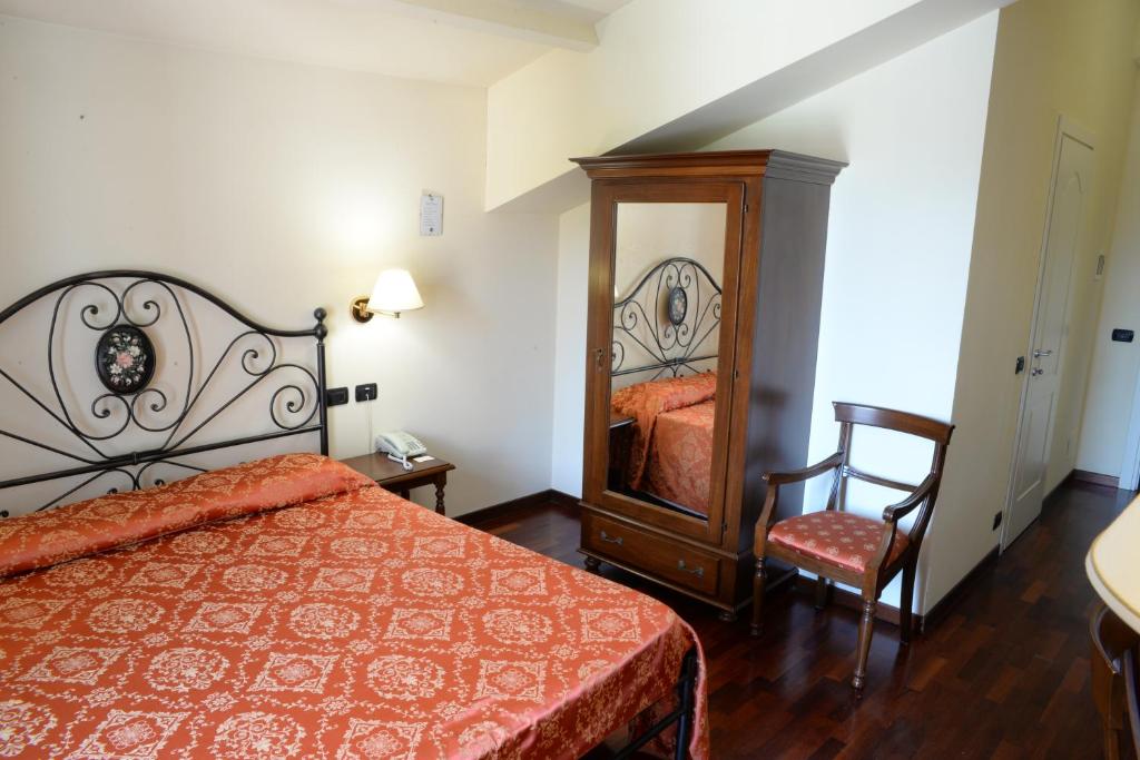 Postel nebo postele na pokoji v ubytování Villa Chiara Hotel
