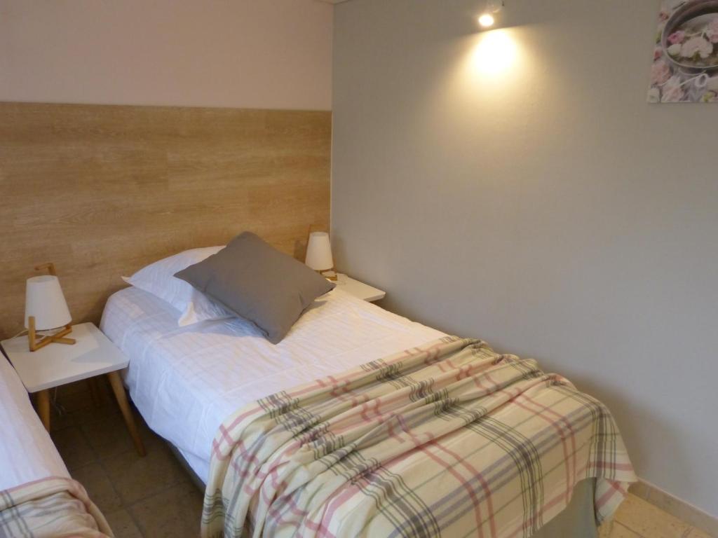 Postel nebo postele na pokoji v ubytování Villa Thebaïde Chambres d'hôtes