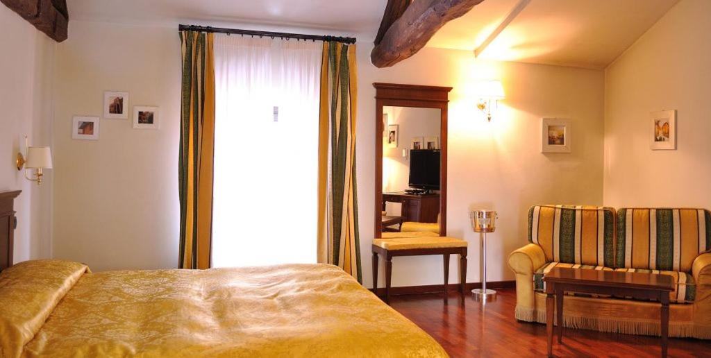 Postel nebo postele na pokoji v ubytování Villa Chiara Hotel