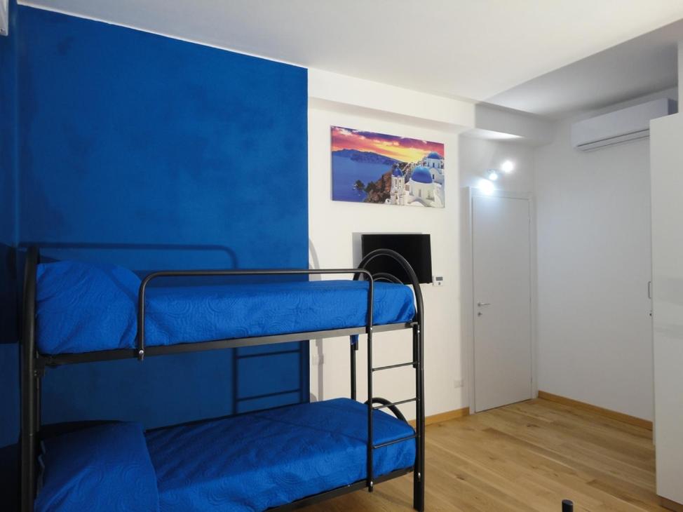 Postel nebo postele na pokoji v ubytování Pavia Ostello