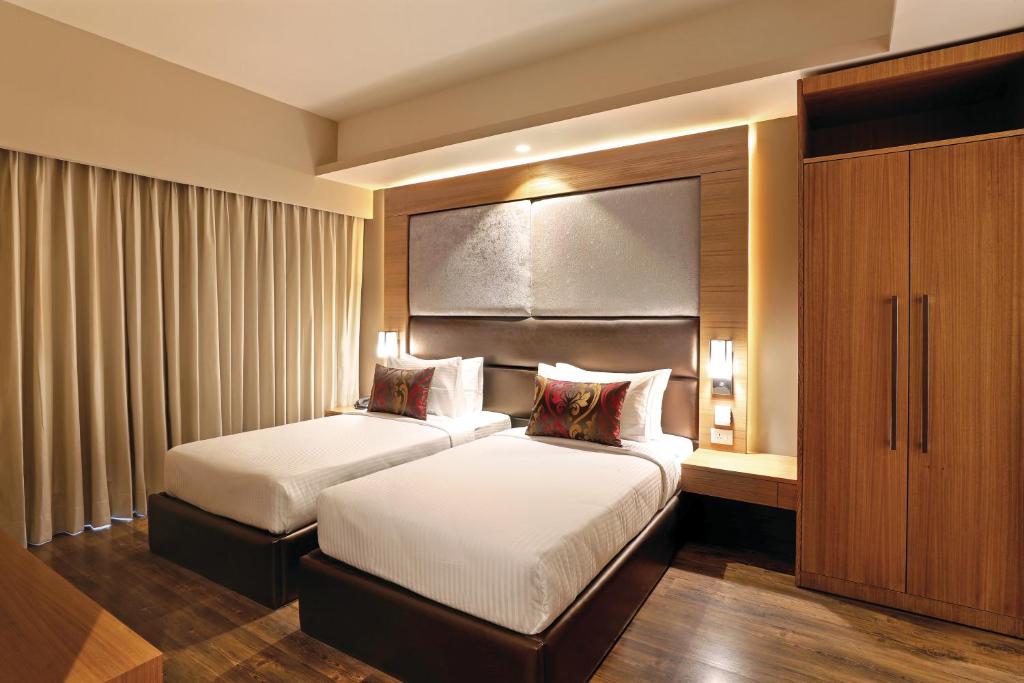 Postel nebo postele na pokoji v ubytování Lemon Tree Hotel, Sector 68, Sohna Road, Gurugram