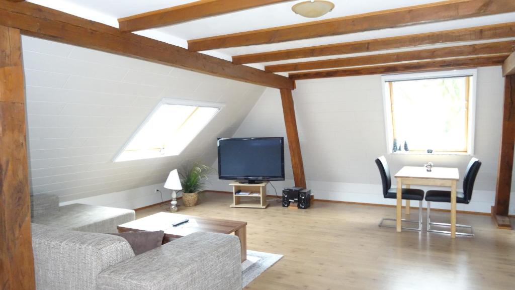 TV a/nebo společenská místnost v ubytování Gästezimmer & Appartement Elskop