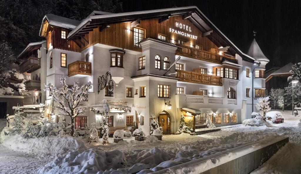 a hotel in the snow at night at Hotel Spanglwirt in Campo Tures