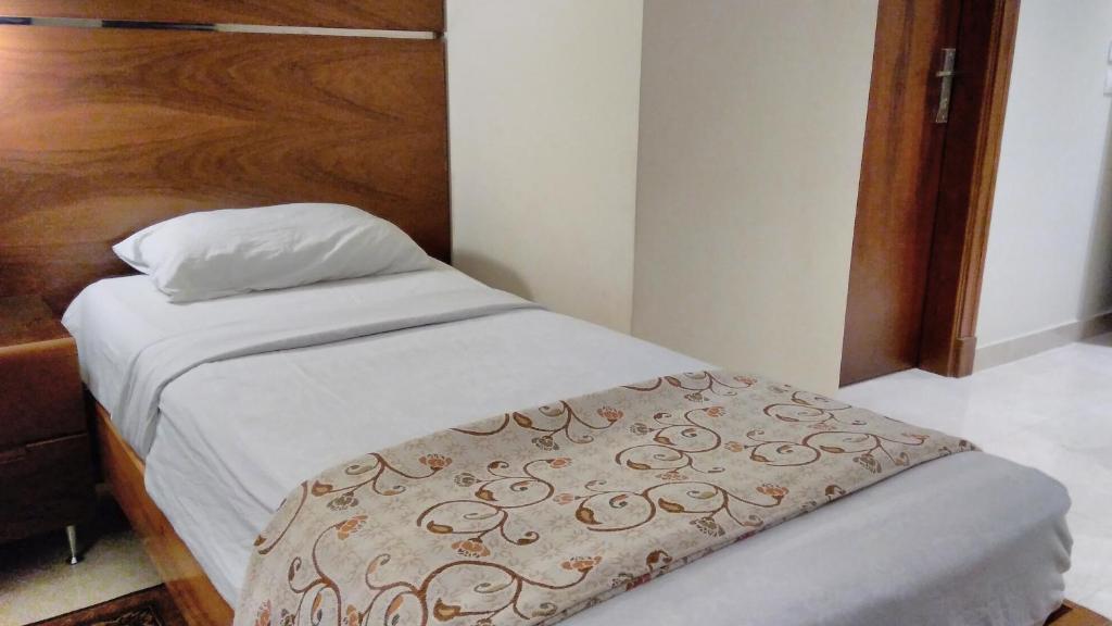 Postel nebo postele na pokoji v ubytování Pharaohs Hotel