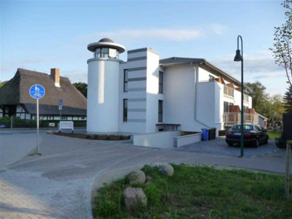 a building with a lighthouse on the side of it at Haus Leuchtfeuer _ Objekt 33839 in Diedrichshagen
