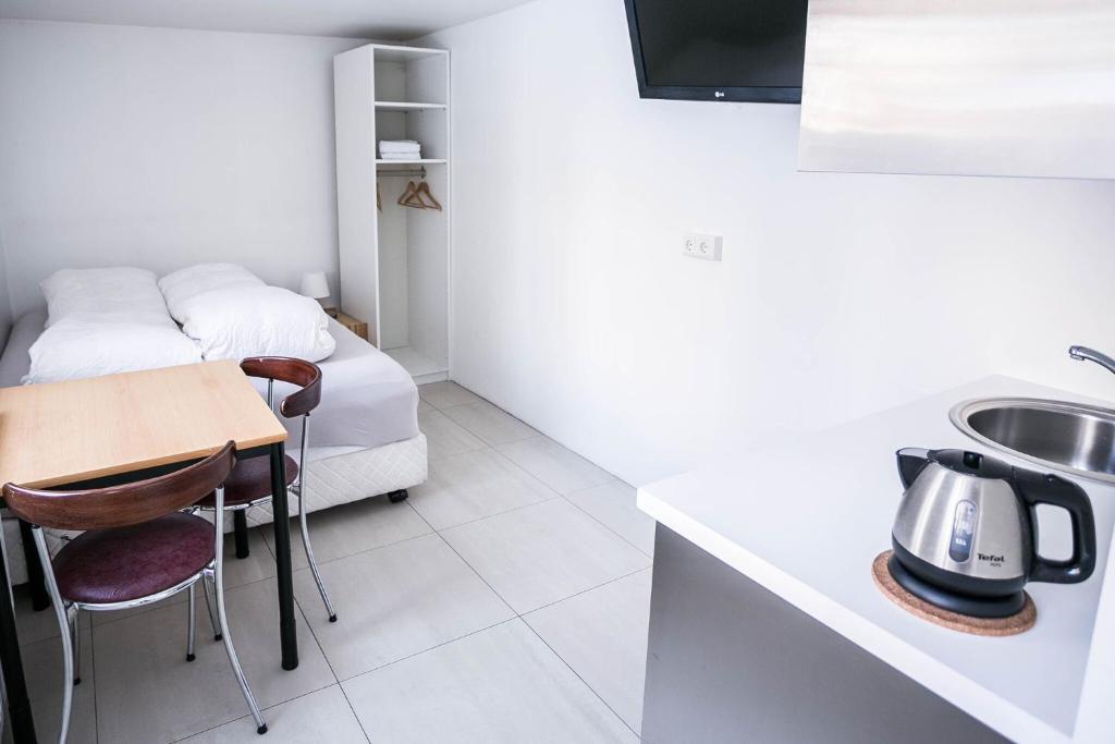 Postel nebo postele na pokoji v ubytování Igdlo Guesthouse