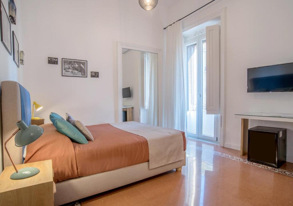 Postel nebo postele na pokoji v ubytování Napoliamo Guest House