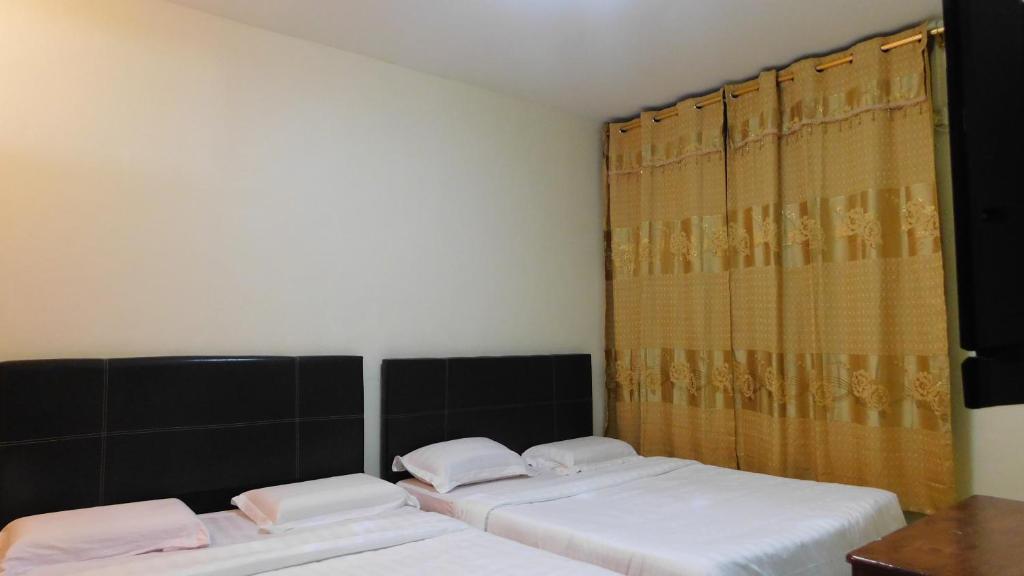 Postel nebo postele na pokoji v ubytování Hotel Ocean