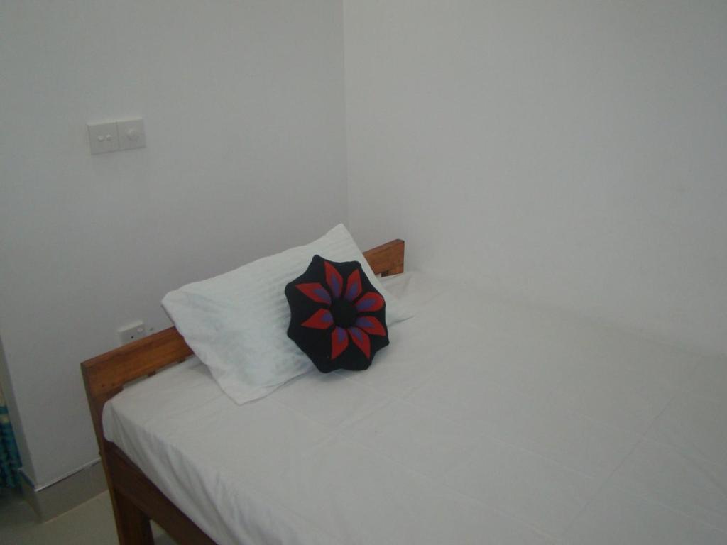 Postel nebo postele na pokoji v ubytování Thuruliya Residence