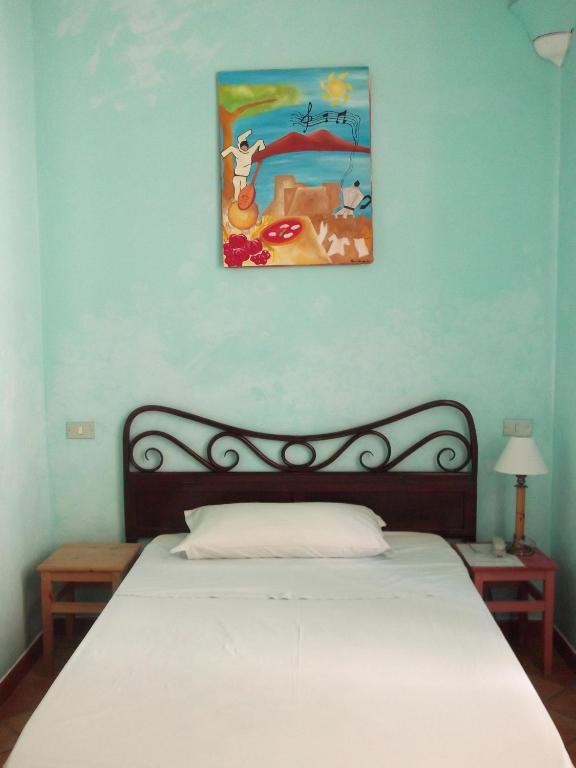 Łóżko lub łóżka w pokoju w obiekcie Chiaia B&B