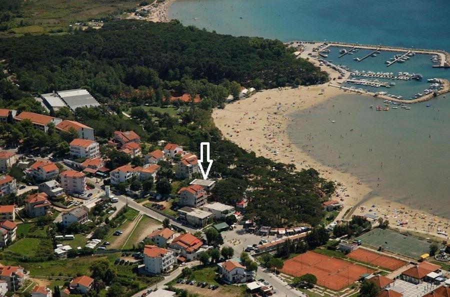 an aerial view of a beach with a group of people at Apartmani Ivana in Lopar