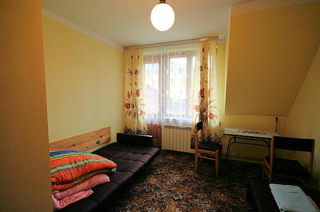 Postel nebo postele na pokoji v ubytování Trzech Koron 16