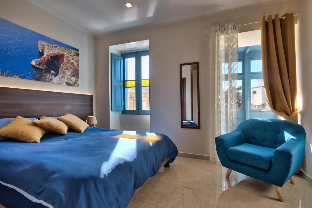 Postel nebo postele na pokoji v ubytování Central Suites St. Julian's