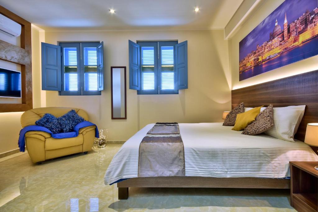 Postel nebo postele na pokoji v ubytování Central Suites St. Julian's