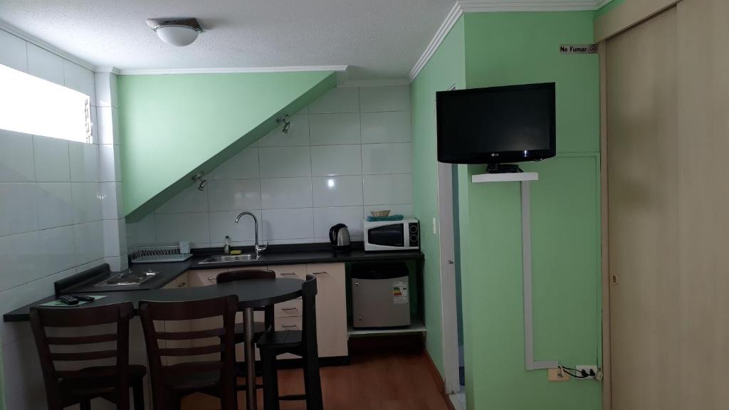 Kuchyň nebo kuchyňský kout v ubytování Apart Hotel Colors