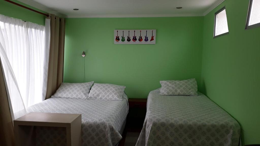 Postel nebo postele na pokoji v ubytování Apart Hotel Colors
