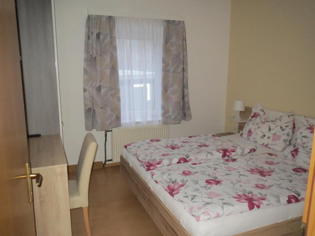 Postel nebo postele na pokoji v ubytování Gasthof Maly