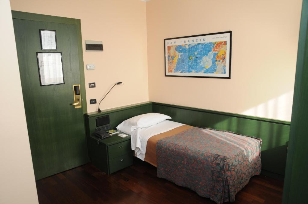 Postel nebo postele na pokoji v ubytování Hotel Del Riale