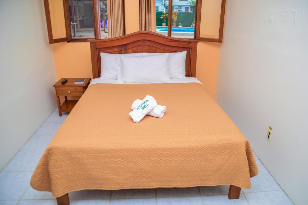 Postel nebo postele na pokoji v ubytování Hosteria Shell