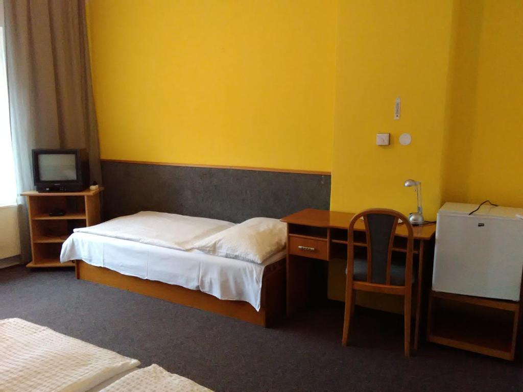 Postel nebo postele na pokoji v ubytování Penzion Vis a Vis