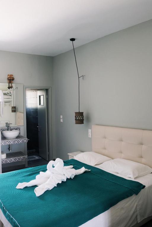 Posteľ alebo postele v izbe v ubytovaní Esperida rooms & studios