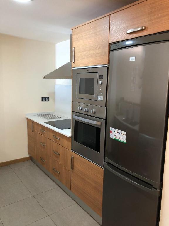 A kitchen or kitchenette at Apartament Neret I