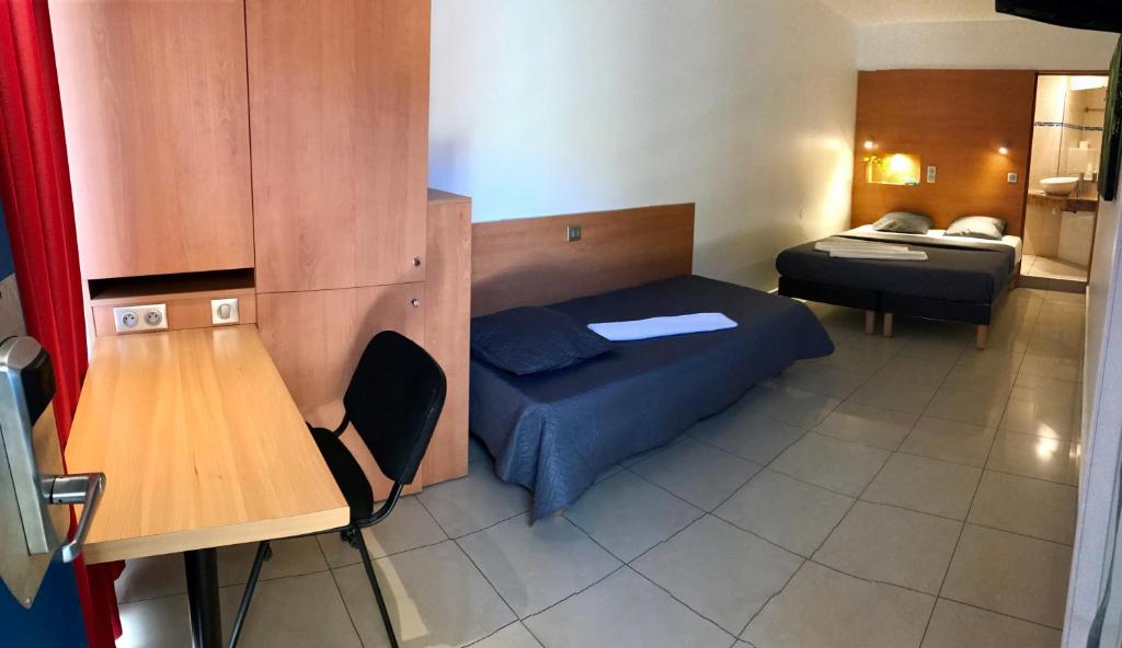 Postel nebo postele na pokoji v ubytování Karaibes Hotel