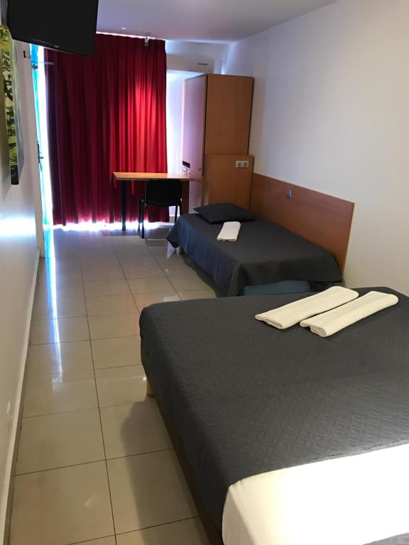 Postel nebo postele na pokoji v ubytování Karaibes Hotel