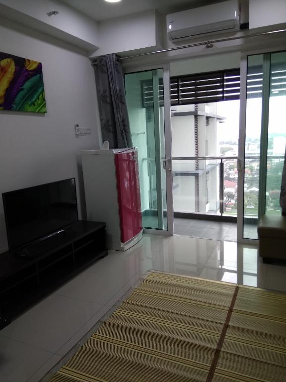 TV a/nebo společenská místnost v ubytování D'Perdana Apartment 2