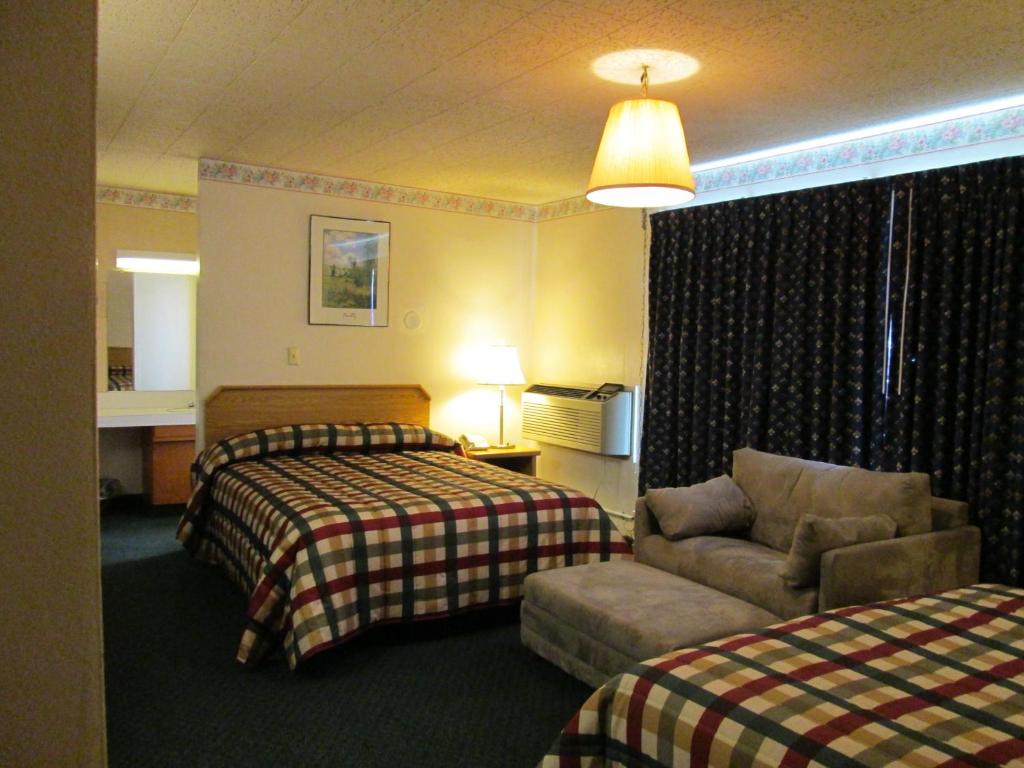 Postel nebo postele na pokoji v ubytování Townhouse Motel