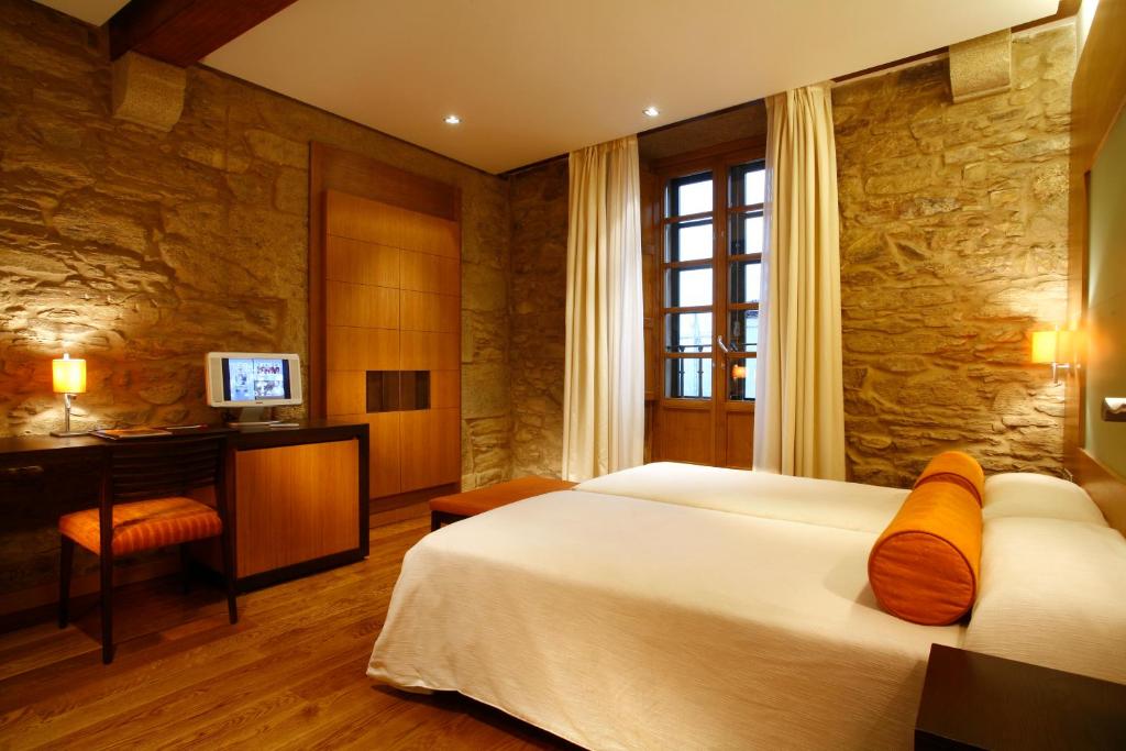 Postel nebo postele na pokoji v ubytování Hotel Altaïr