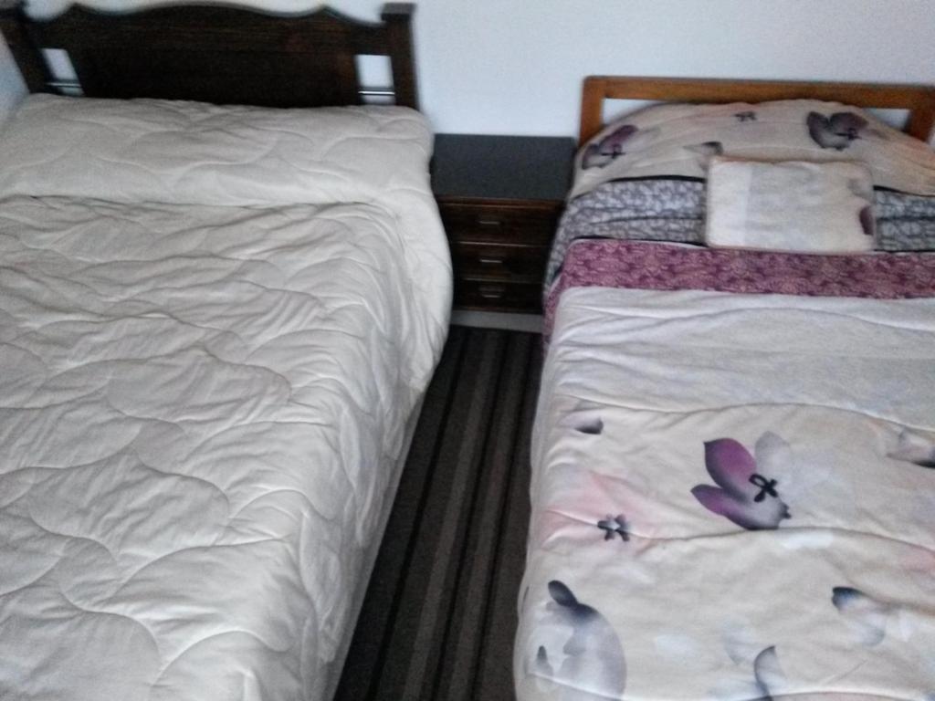 Postel nebo postele na pokoji v ubytování Hospedaje El Mirador