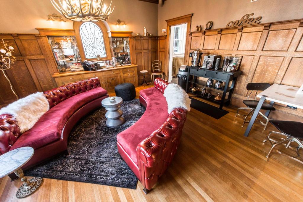 a living room with a couch and a table at Ember Hostel in Denver