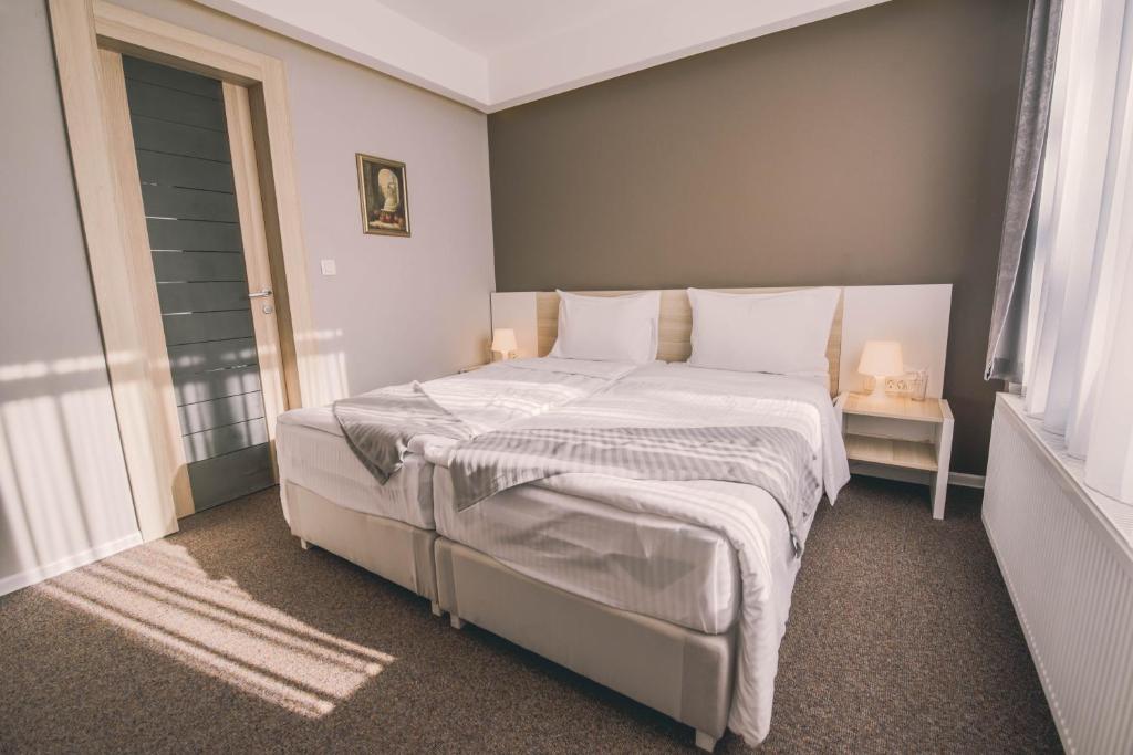 Posteľ alebo postele v izbe v ubytovaní Hotel Nova Bentbaša