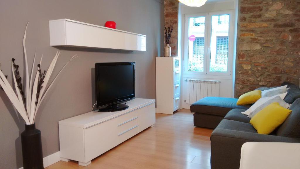 Televízia a/alebo spoločenská miestnosť v ubytovaní Matia apartamento