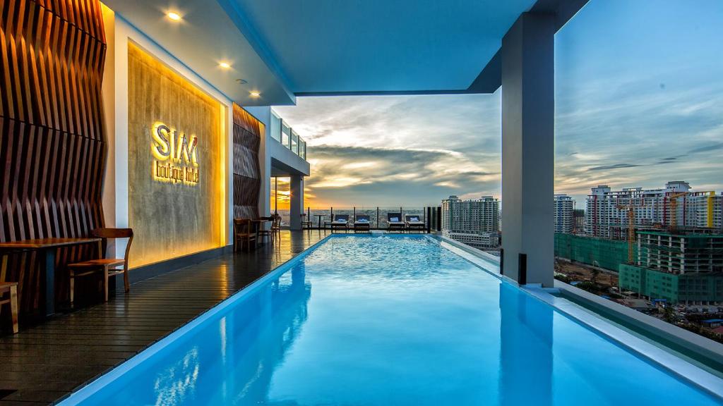 a swimming pool on the roof of a building at SIM Boutique Hotel in Phnom Penh