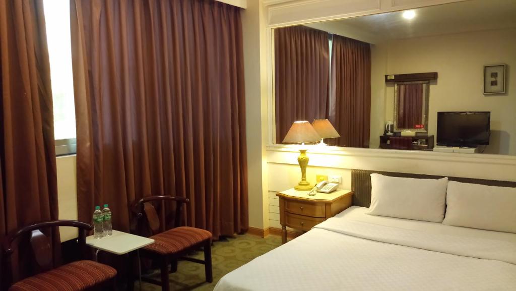 Postel nebo postele na pokoji v ubytování 苓雅大飯店 Lingyea Hotel