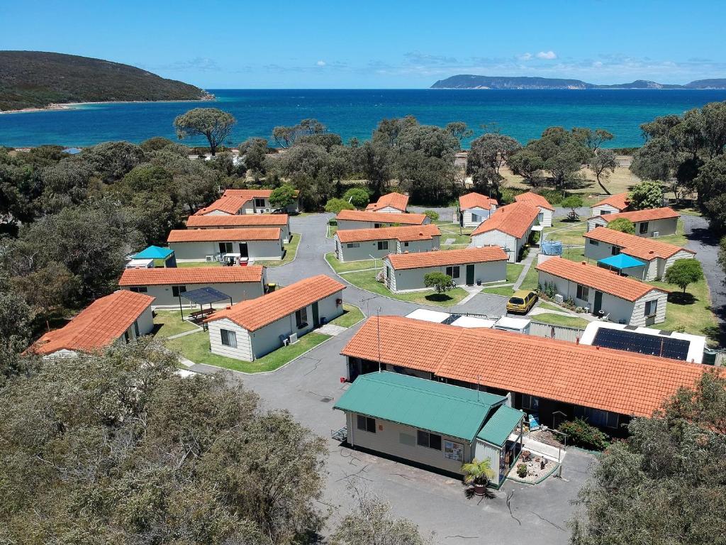 an overhead view of a row of houses with orange roofs at Havana Villas in Albany