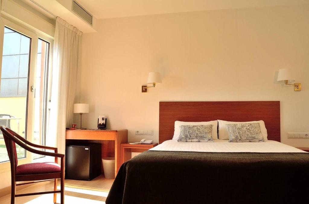 Postel nebo postele na pokoji v ubytování Hotel Ultonia