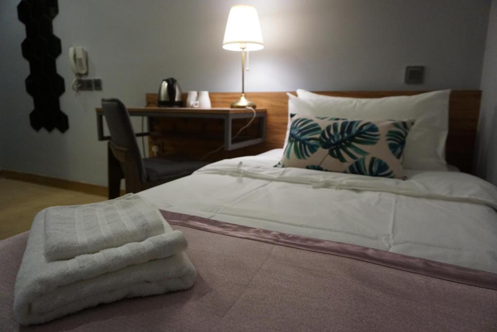 Postel nebo postele na pokoji v ubytování Hotel Gaia 95