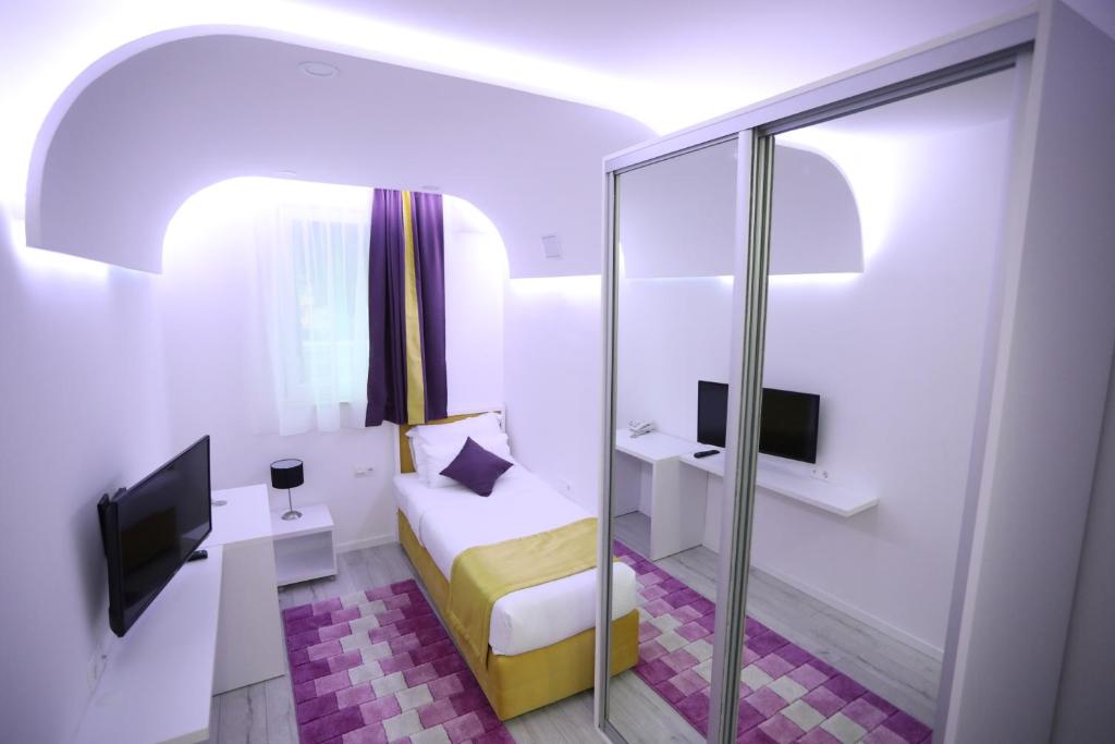 Postel nebo postele na pokoji v ubytování Hotel Boutique Libris